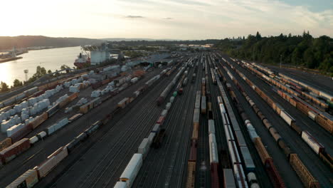 Circling-aerial-shot-over-large-freight-train-yard