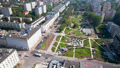 central park in gdynia - modern urban district in city center next to busy street and modern office buildings - high up aerial parallax