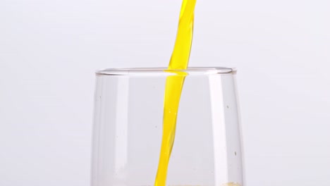 orange juice pouring into glass