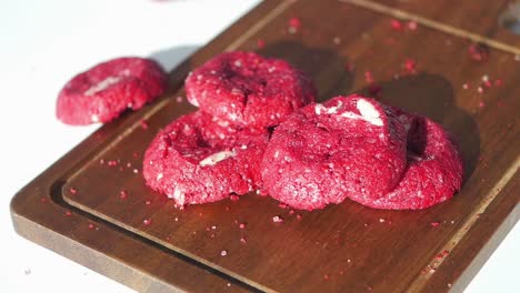 red velvet cookies on wooden cutting board