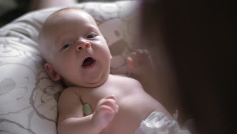 Newborn-baby-yawning-with-her-mother