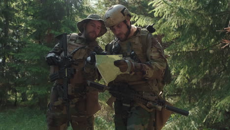 soldiers looking at map