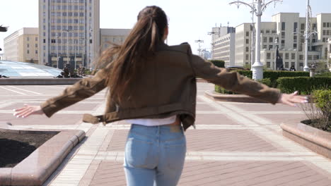 woman laughing in city park