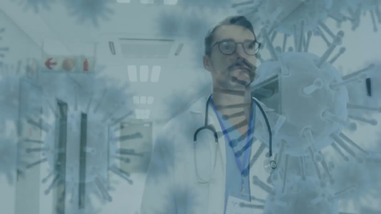 las células de covid-19 se mueven contra el médico masculino que camina en el hospital