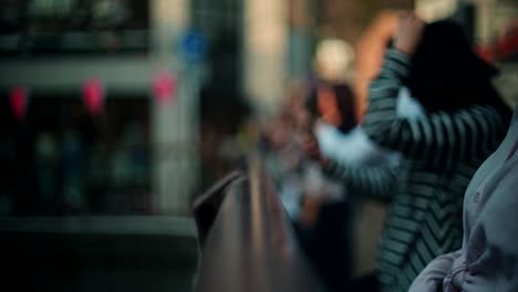 people taking pictures on a city street