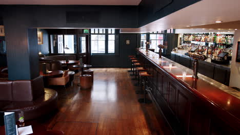 empty bar interior with counter and seating