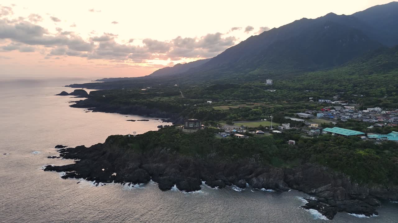 Coastal Landscape with Mountains at Sunset
