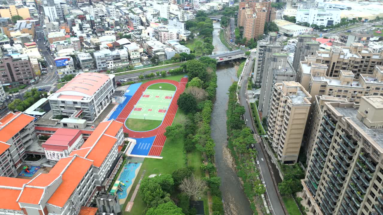 Luzhu district in taoyuan city, taiwan, showing a school and surrounding buildings, aerial view