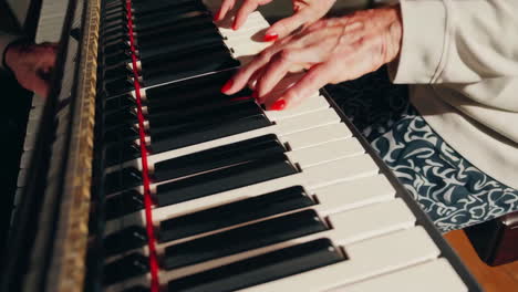 elderly woman playing piano at home