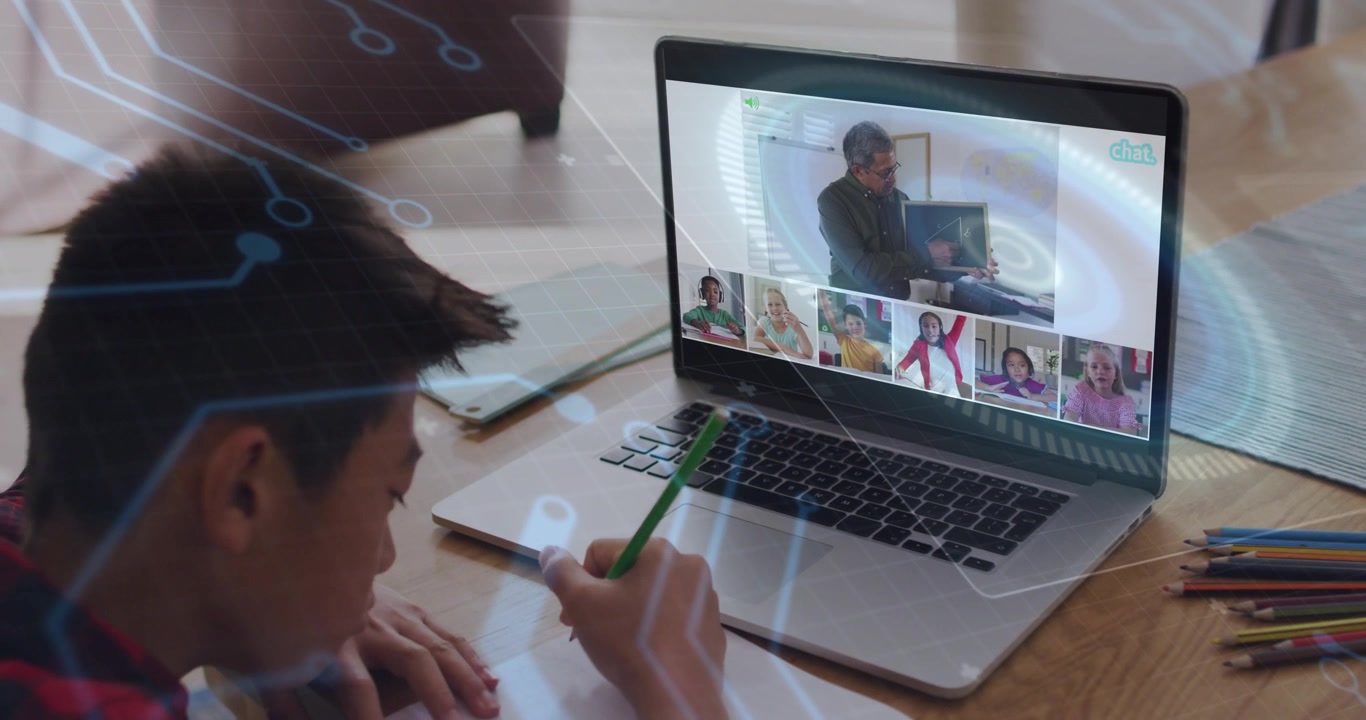 Boy writing at home following teacher on laptop showing chalkboard, circuit overlay linking paper