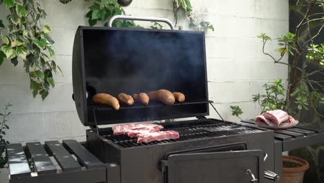 chef cooking tasty ribs pork on barbecue grill. delicious grilled pig cooked bbq