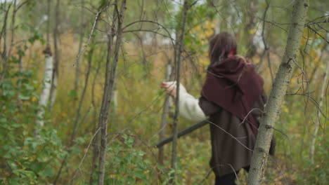 Warrior-girls-look-for-traces-of-enemy-walking-between-trees