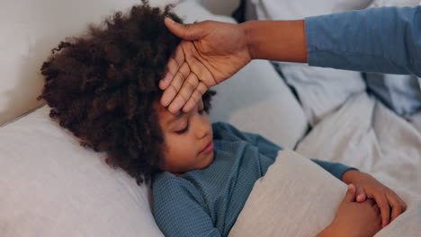 sick child with fever being cared for