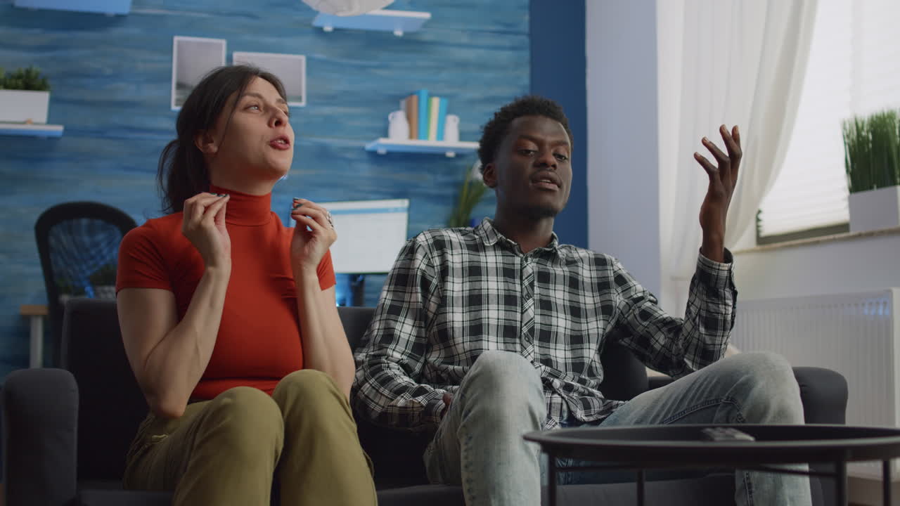 Angry interracial couple with relationship problems fighting