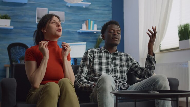 Angry interracial couple with relationship problems fighting