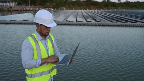 asian engineer working at floating solar farm