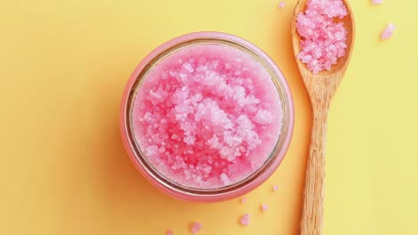 pink salt scrub in a glass jar