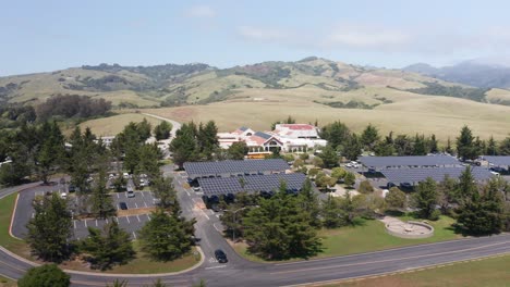 aerial close-up panning shot of the hearst castle visitor center in san simeon, california