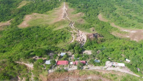 Nice-afternoon-aerial-forward-view-from-the-hillside-through-the-trail-path-road