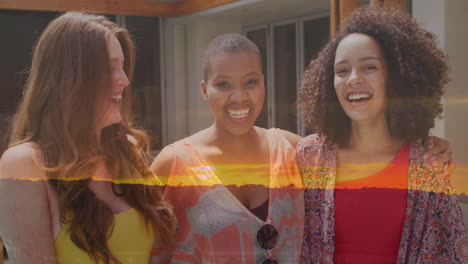 embracing and smiling, three women with sunset animation creating warm atmosphere
