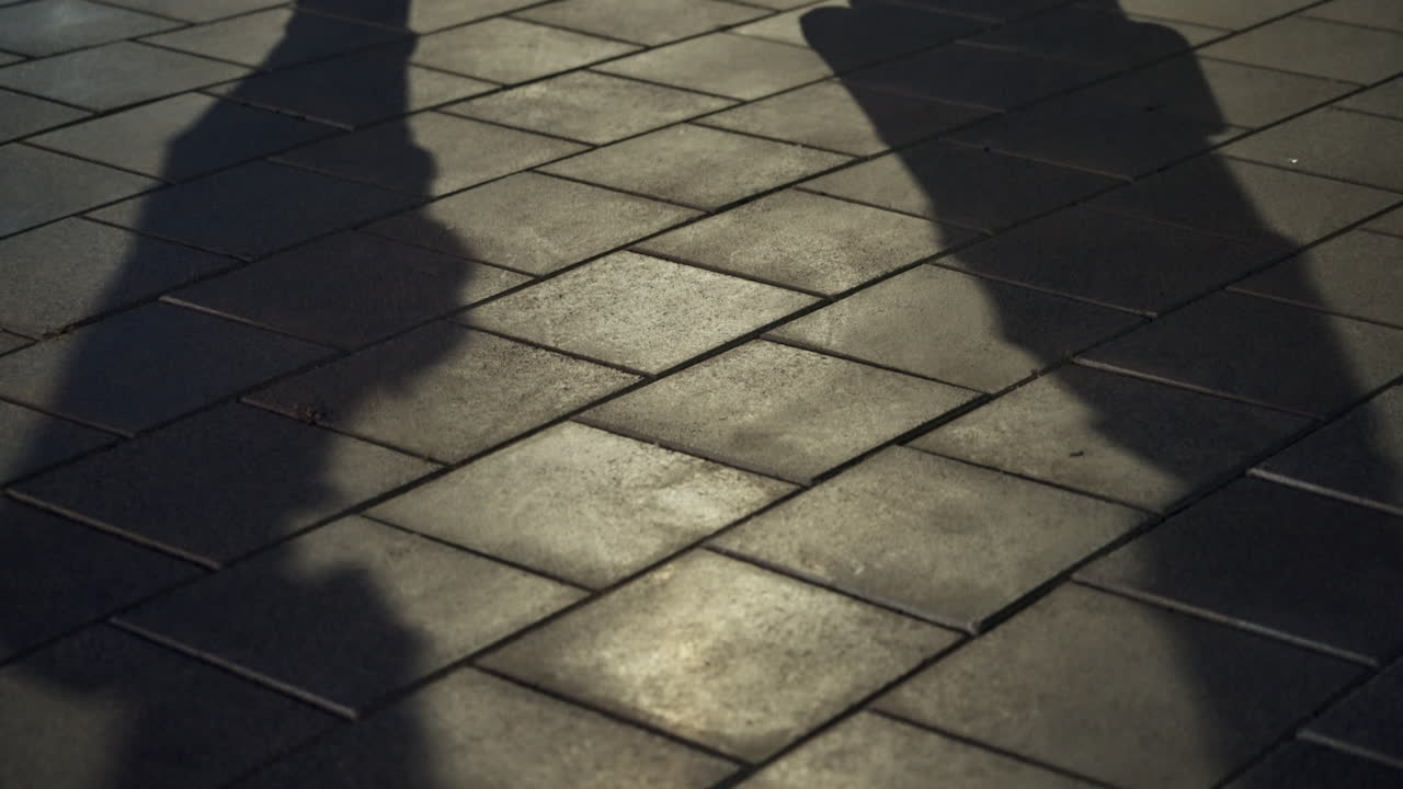 Exchange of briefcase and envelope in secret deal in street by two people. Shadows of man and woman making dirty business deal or criminal activity. Shady suspicious payment or bribe by agent or spy