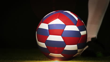 Football-player-kicking-russia-flag-ball