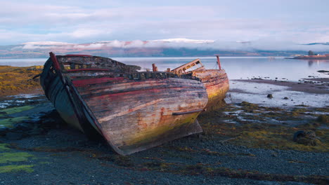 stunning cinematic tracking shot of rotting wooden boats