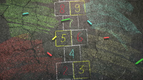 Closeup-colorful-chalk-on-blackboard-school-background