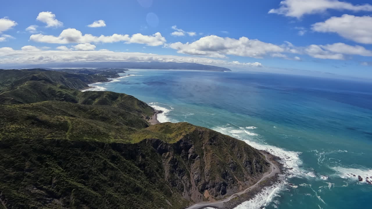 POV helicopter shot flying along the North island coastline towards Wellington, New Zealand