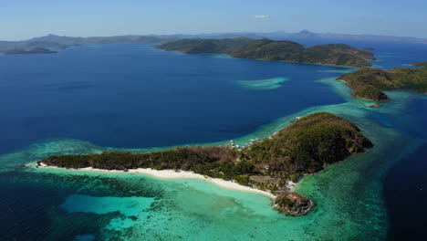 aerial view of malcapuya beach island in a sunny day, coron, palawan, philippines