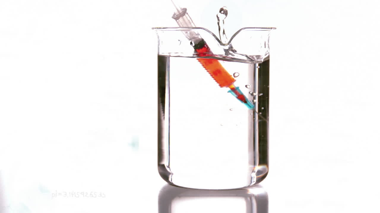 Animation of syringe falling in a beaker against white background