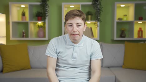 close-up of young man expressing worried and agitated.