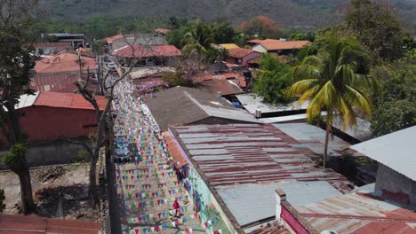 colorful pennant banner flags hang over charming street in copan, hnd