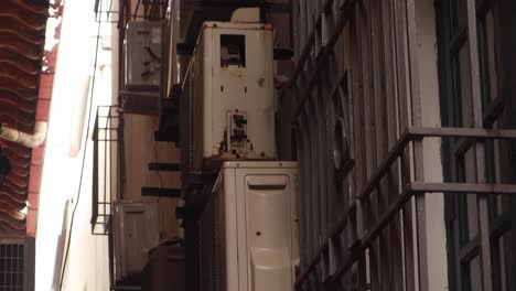 maintenance ally way displaying air conditioning exterior units, part of an office and residential building at panama city's casco viejo