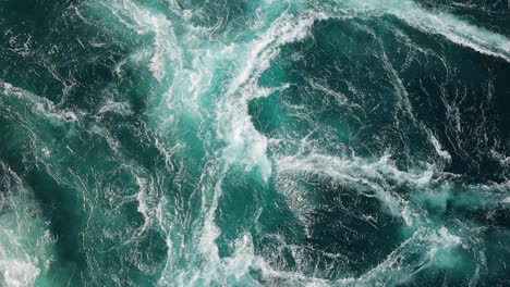 blue waves of water of the river and the sea meet each other during high tide and low tide.