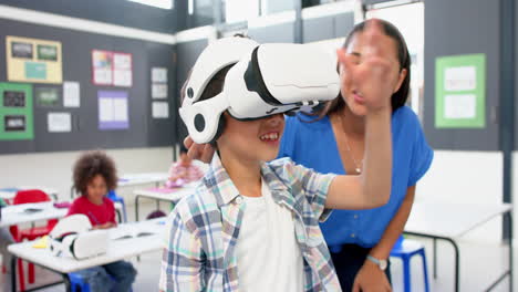 in school, teacher helping student using vr headset in classroom activity
