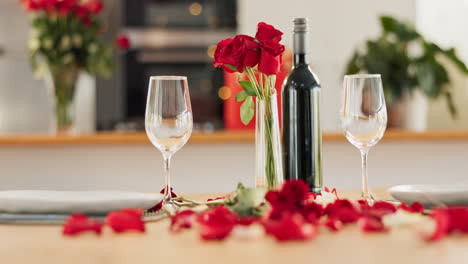 romantic dinner setting with roses and wine