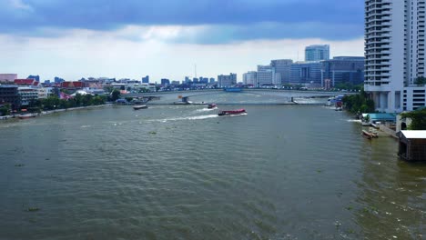 watercourse of chao phraya river with passenger ship sailing in bangkok, thailand
