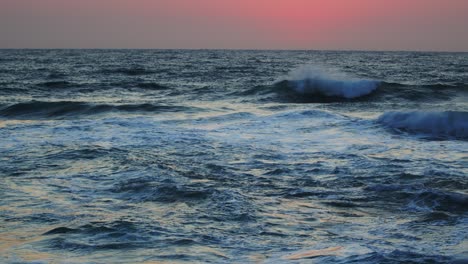 beautiful red sky over the indian ocean, durban kwazulu-natal south africa. summer sunset seascape.
