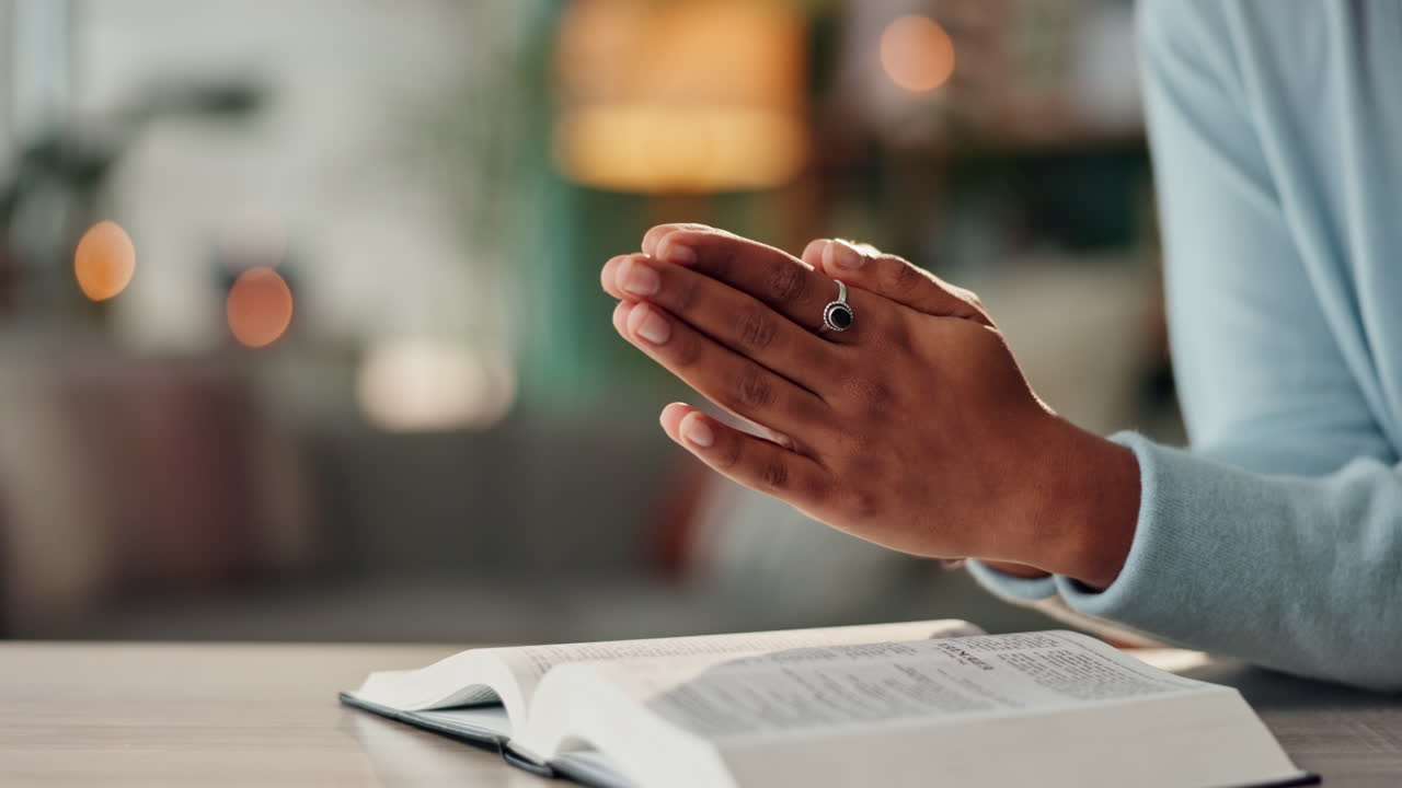 Woman praying with a Bible