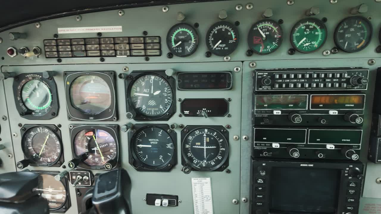 Control Panel In A Plane Cockpit Of Cessna 208B Grand Caravan Flight From Zanzibar to Tanzania. Tracking Shot