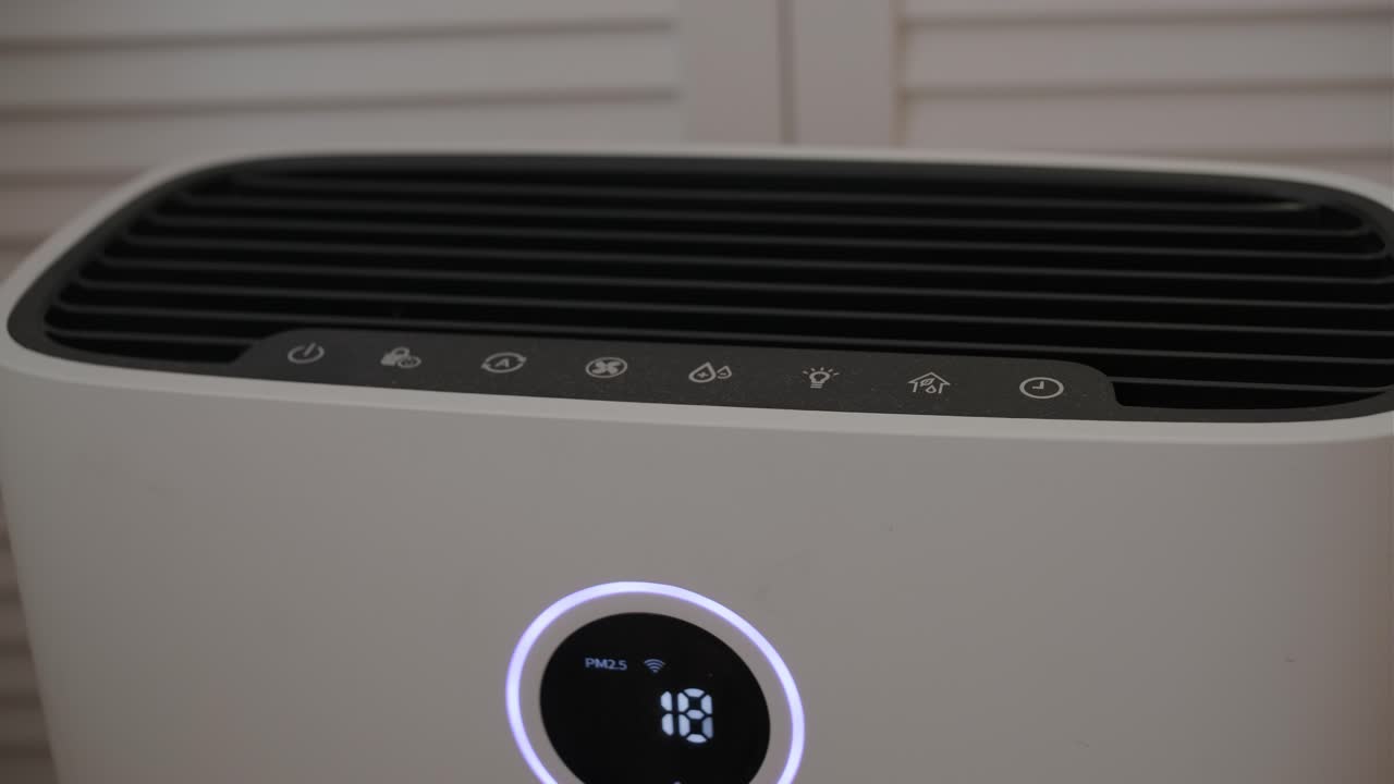 Close-up of a Modern Air Purifier with Digital Display