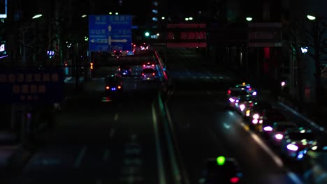 a night timelapse of the miniature traffic jam at the city street in tokyo