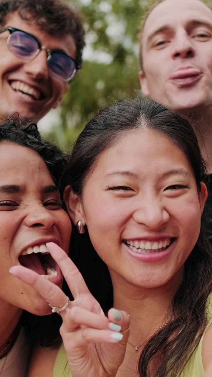 Diverse group of interracial students smiling and looking at camera, focus on
