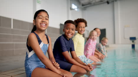 children sitting by a swimming pool