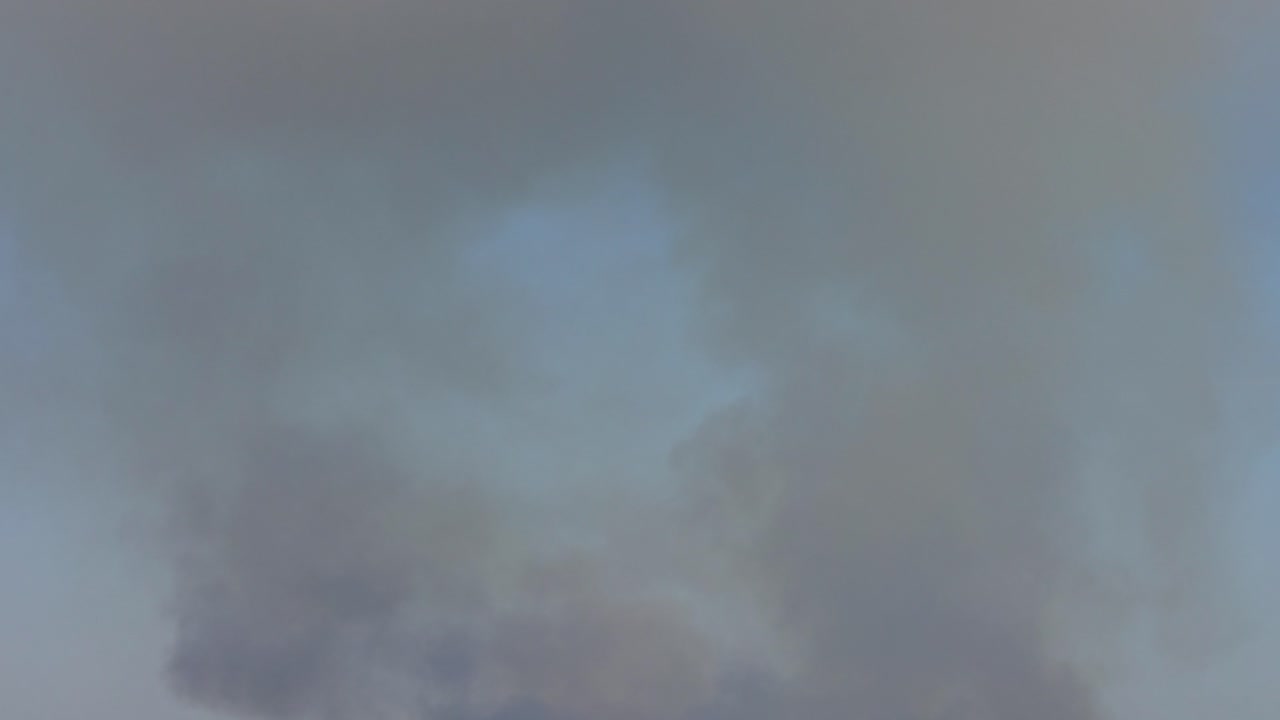The fire over the wood. Smoke shooting
