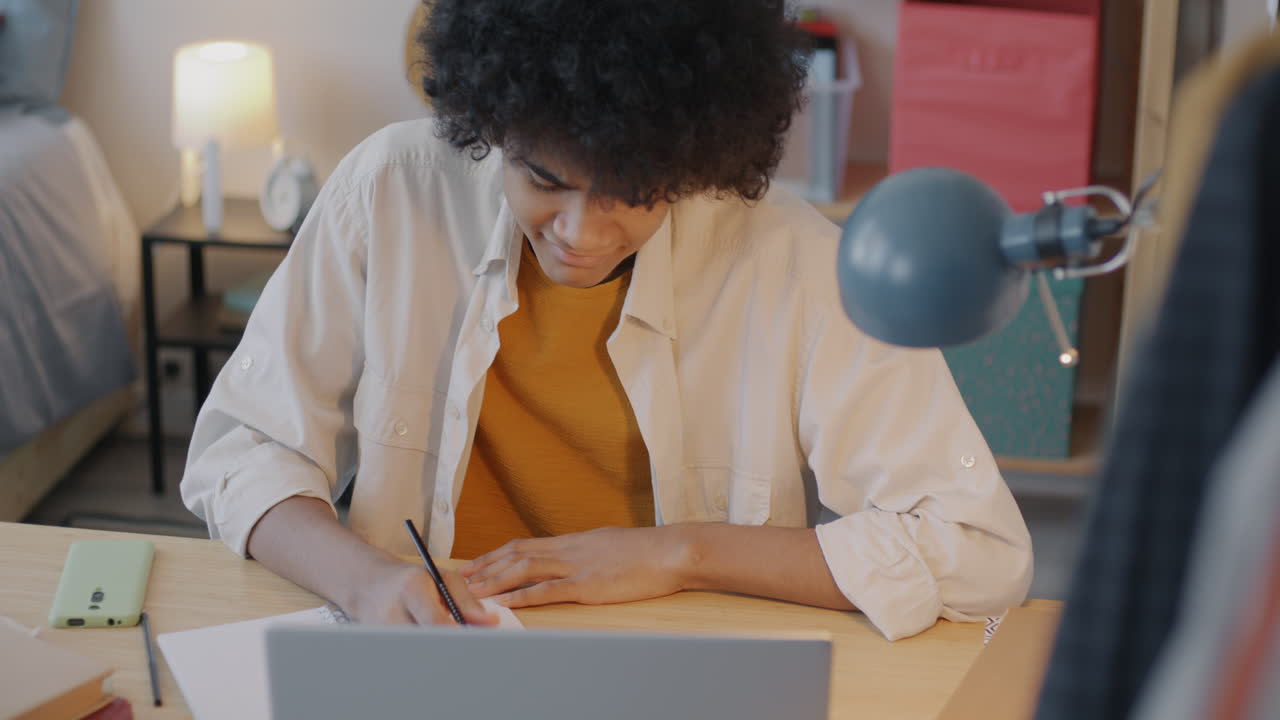 Teenager Studying at Home