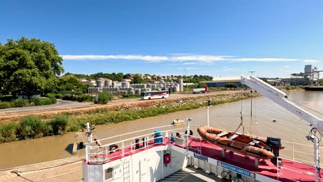 a boat approaches the pier in blaye, france