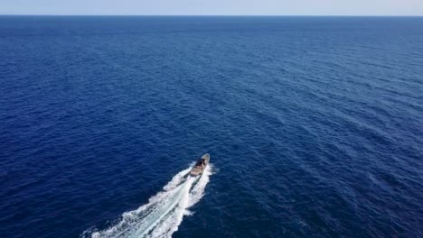 flying with a boat on the blue ocean