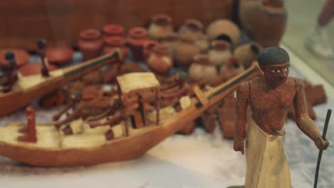 miniature boat with figures and pottery